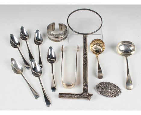A set of six George V silver grapefruit spoons, Birmingham 1934, a pair of George IV silver sugar tongs, London 1828 by Morri