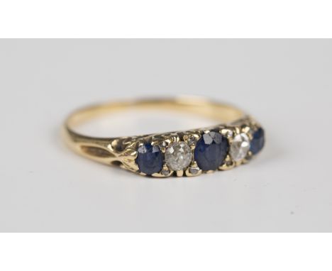 A gold, sapphire and diamond five stone ring, mounted with three cushion cut sapphires and two cushion cut diamonds with rose