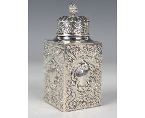 A late Victorian silver rectangular tea caddy with reeded domed cover and flower bud finial, each side embossed with a 'C' sc