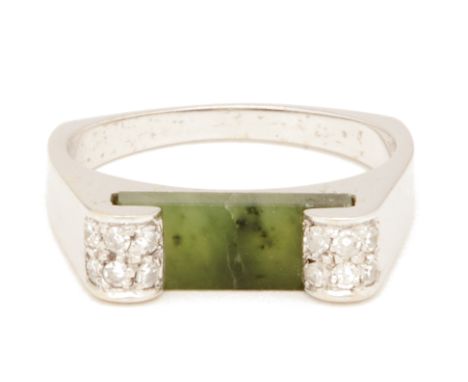 A JADE AND DIAMOND RING Set in 14K white gold with a rectangular section of jade flanked by round brilliant cut diamonds US r