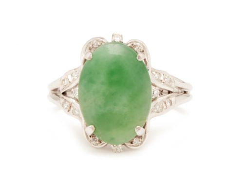 A JADE AND DIAMOND RING
In 18k white gold, the oval jade cabochon in a diamond setting
US ring size 6.5
3.7g
Condition: No ob