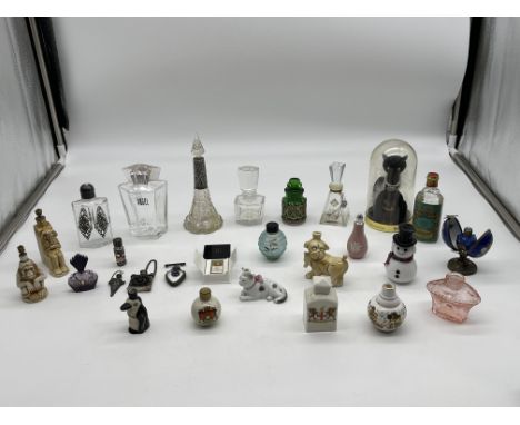 Collection of Antique and Vintage Perfume Bottles to include HM Silver examples and other rarities. 