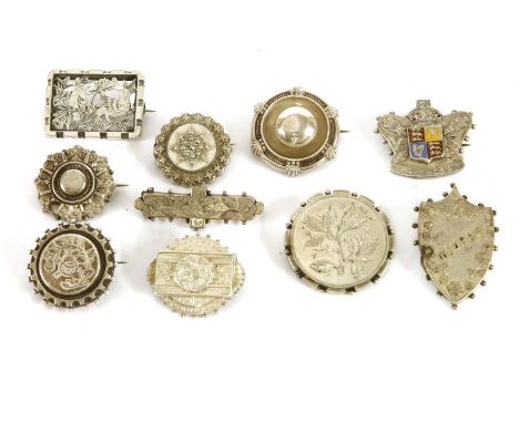 A collection of Victorian silver brooches, including a silver '1887' Jubilee crown brooch with enamel shield, a Scottish circ