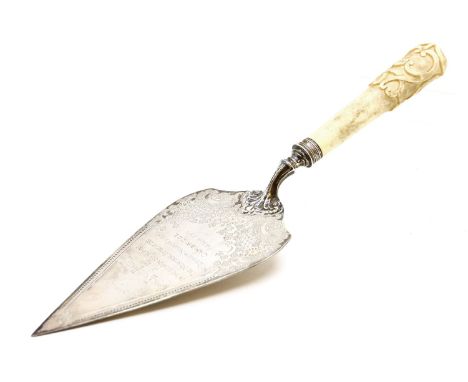 An Edwardian ivory handled silver trowel, Sheffield 1902, maker's mark H.A., the blade with chased flowers and 'C' scrolls an