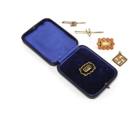 A Georgian gold coral cabochon brooch, a gold swastika pendant, marked 9ct, a gold bar brooch with knot and ball applied deco