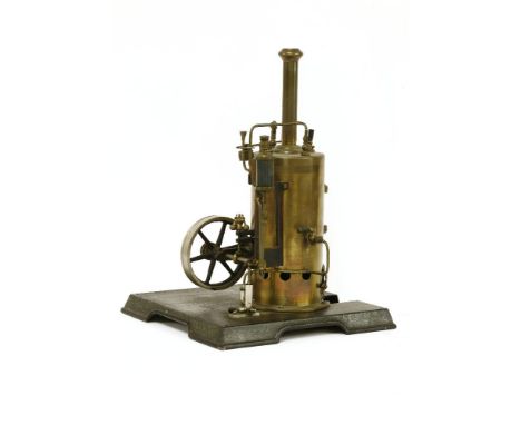 A Marklin stationary engine, with a vertical boiler, six spoke fly wheel, with a single piston, on a shaped base, 38.5cm high