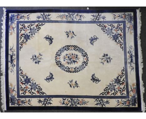 A blue and white Chinese carpet, 365cm x 270cm
