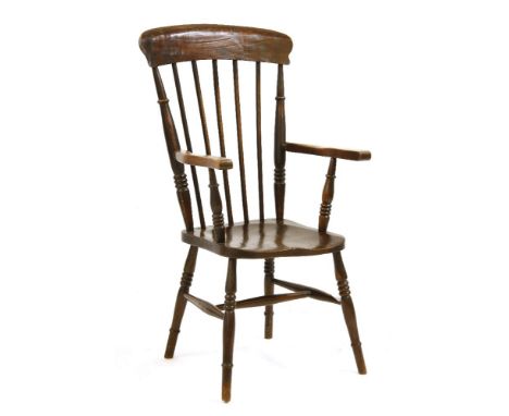 A late 19th century stick back open armchair, with solid seat on stretchered tunnel supports, 110 cm high