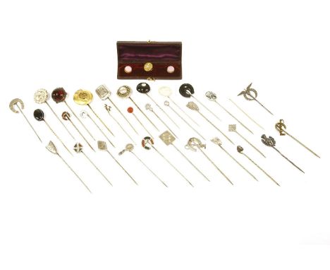 A collection of stick pins, to include a silver shield example with engraved floral decoration, a Victorian silver stepped ex