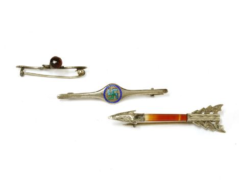 A Charles Horner silver thistle bar brooch with citrine bud, Chester 1929, a Charles Horner blue and green enamel Swastika ba