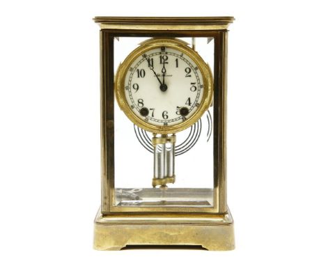 A late 19th century brass cased four glass mantel clock, by Seth Thomas with painted enamel dial and visual mercurial pendulu