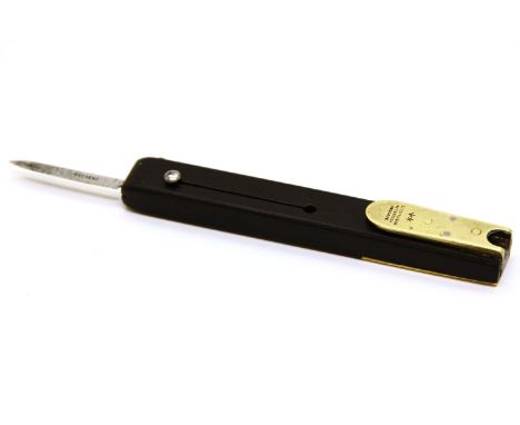 A Victorian ebony quill pen cutter, with brass mounts and a steel blade, the metalwork marked 'Rodgers, Cutlers to Her Majest