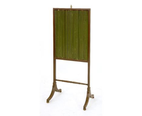 A mahogany fire screen, 19th century, with adjustable louvres and on swept feet,46cm wide, 117cm highProvenance:  The Estate 