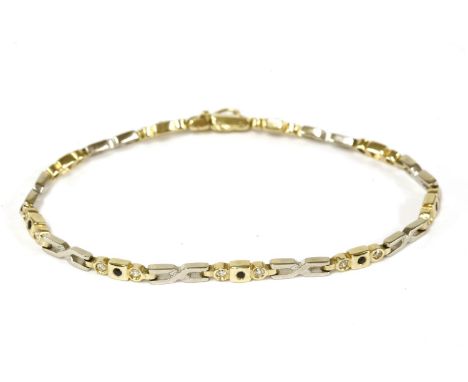 A two colour gold bracelet, sapphire and cubic zirconia fancy link bracelet, marked 585, tested as approximately 14ct, 10.99g