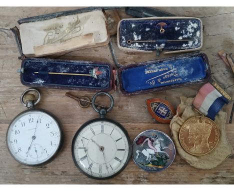 A mixed lot including two hallmarked silver pocket watches, an enamelled crown, a silver badge, stick pins etc.