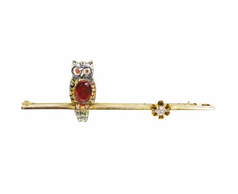 A vintage diamond brooch with enamel owl set with a red stone, marked 9KT, length 52mm, gross weight 2.6g.