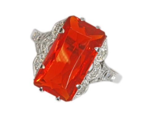 A FIRE OPAL AND VARI-CUT DIAMOND RING, the rectangular mixed cut opal measuring approximately 15.42mm x 8.37mm, depth 5.91mm,
