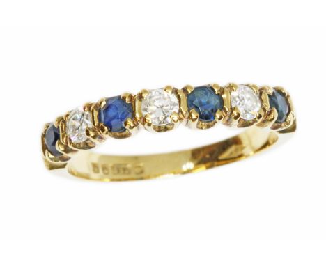 A diamond and sapphire ring, hallmarked 18ct gold, sponsor BH, London 1982, gross weight 2.7g, size K.