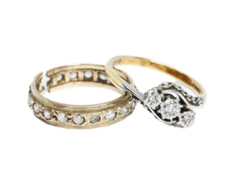 A three stone diamond ring marked 18ct&amp;PT, weight 2.5g, together with a colourless stone eternity band marked 9ct, weight