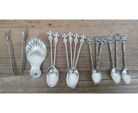 A mixed lot comprising a hallmarked silver caddy spoon and a pair of hallmarked silver sugar tongs together with two sets of 