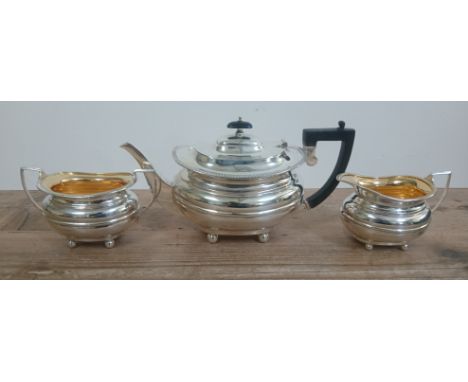 A three piece hallmarked silver tea service, gross weight 36oz 9dwt.