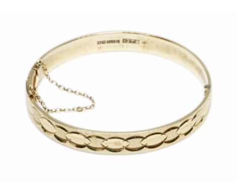 A 9ct gold bangle, sponsor R.J.Co, Birmingham 1972, diameter 55mm to 58mm, weight 22.8g.Condition - good, general wear.