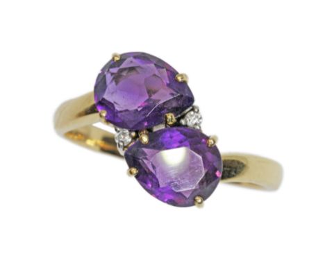 An amethyst and diamond ring, marked 18K, gross weight 6g, size X.