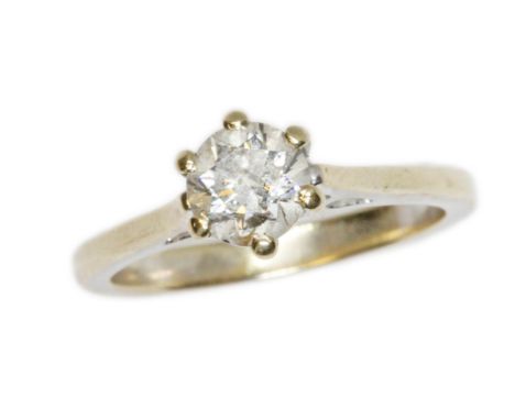 A diamond solitaire ring, the round brilliant cut stone weighing approximately 0.65ct, hallmarked 18ct white gold band, gross