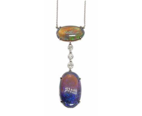 AN OPAL AND DIAMOND PENDANT NECKLACE, two double sided oval opal cabochons four claw set in white metal, the top opal measuri