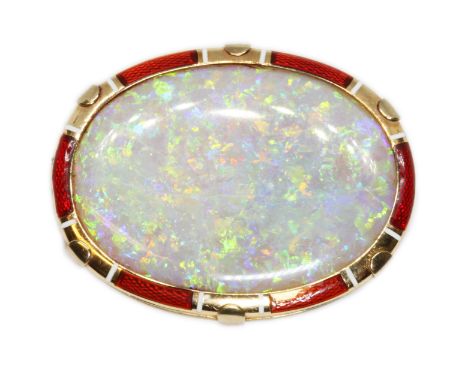 AN ANTIQUE OPAL BROOCH, the double sided oval opal cabochon measuring approximately 35mm x 26mm and depth 5.35mm, guilloche e