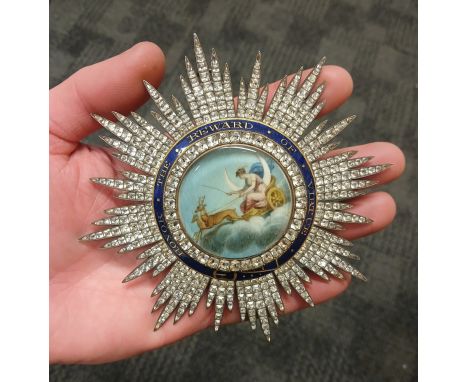 A GEORGE III DECORATION, circa 1800, possibly Masonic or civil, gilt metal with central portrait miniature on ivory depicting