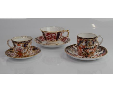 Three Royal Crown Derby Imari pattern cups and saucers.