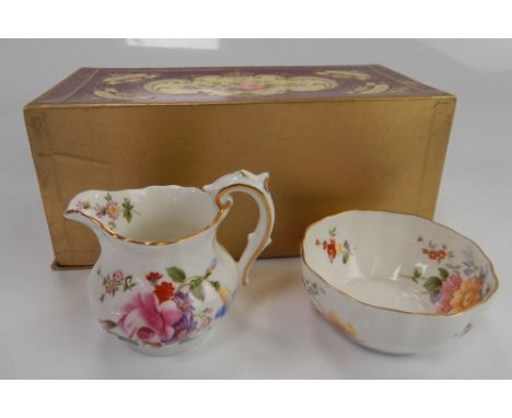 A Royal Crown Derby Derby Posies pattern cream jug and sugar basin, in original box.