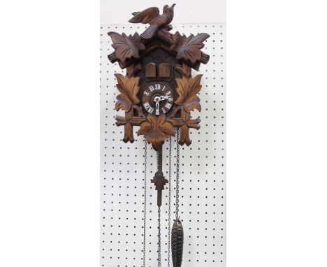 A small Black Forest style cuckoo clock, 29cm.
