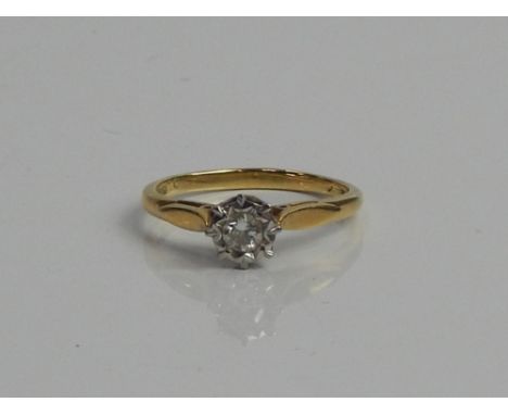 An 18ct gold diamond solitaire ring, with illusion set diamond centre.