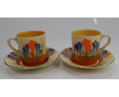 Two Clarice Cliff Bizarre Crocus pattern coffee cans and saucers.