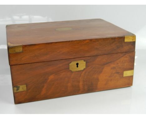 A Victorian walnut writing slope, with original fitted interior and having brass bound corners and a blank cartouche name pla