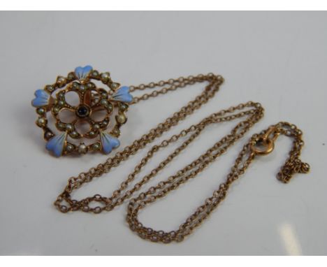 A decorative pendant and chain, the pendant with enamel painted leaves, inset seed pearls and blue stone centre, on yellow me