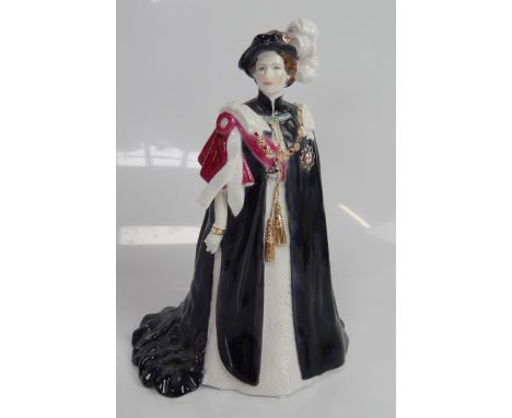 A Royal Worcester figure of Queen Elizabeth II, The Order of the Garter, 15.5cm high.