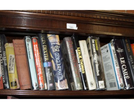 A shelf of murder mystery books, including signed Colin Dexter.