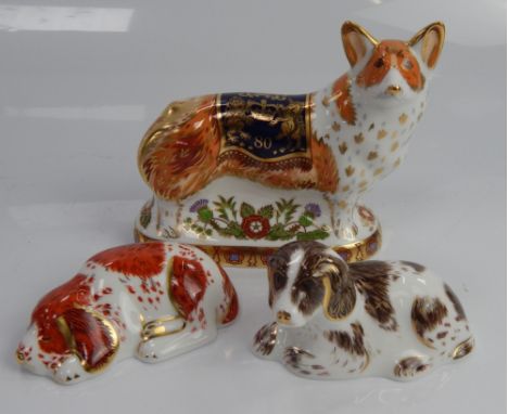 Three Royal Crown Derby dog paperweights, including The Royal Windsor Corgi.