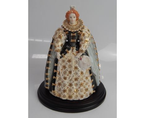 A Royal Worcester figure of Queen Elizabeth I, 13.5cm high, with loose plinth base.
