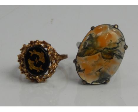 Two dress rings, to include a 9ct gold dress ring, engraved with fish and a silver dress ring, (2).