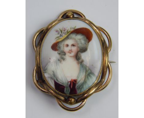 A Victorian enamel brooch, with half length portrait of a lady in a floral hat, in gilt framed border.