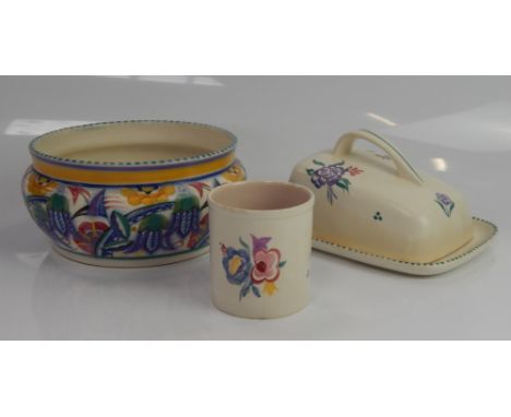 A Poole Pottery bowl, with stylised flower decoration,19cm diameter, a Poole Pottery cheese dish and a beaker vase,  (3).