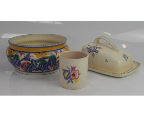 A Poole Pottery bowl, with stylised flower decoration,19cm diameter, a Poole Pottery cheese dish and a beaker vase,  (3).