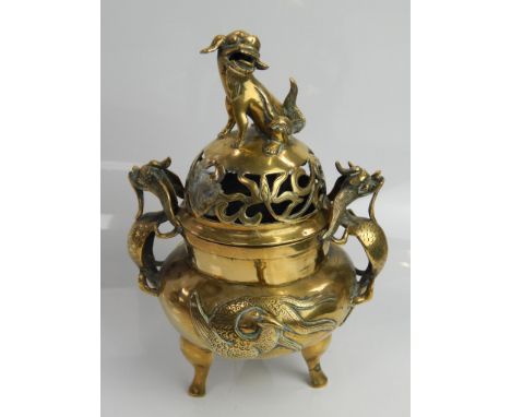 A 19thC Chinese brass censor vase and cover, with Dog of Fo knop handle and stylised dragons and birds in relief, with square