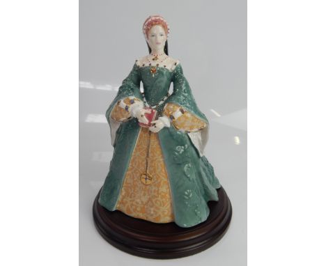 A Royal Worcester figure of Queen Mary I, 22cm high, with loose plinth base.