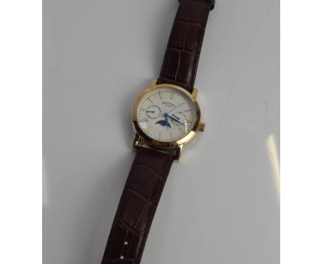 A Rotary gents wristwatch, with date and day dials, gold plated case, on a brown leather strap.