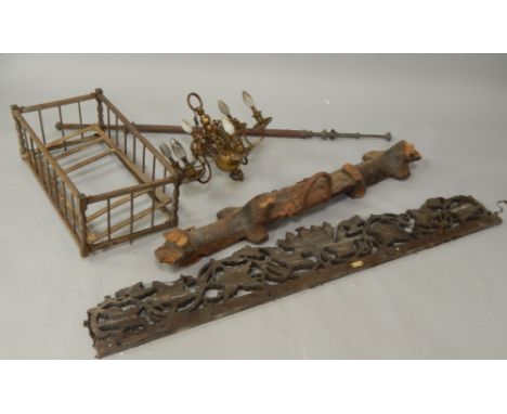 A brass six branch pendant light fitting, a double oxen yoke (worm damage), a carved wood furniture cresting ornament and a c